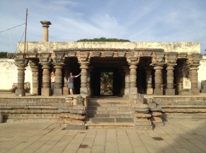 With A, at the gate in the wall surrounding the temple